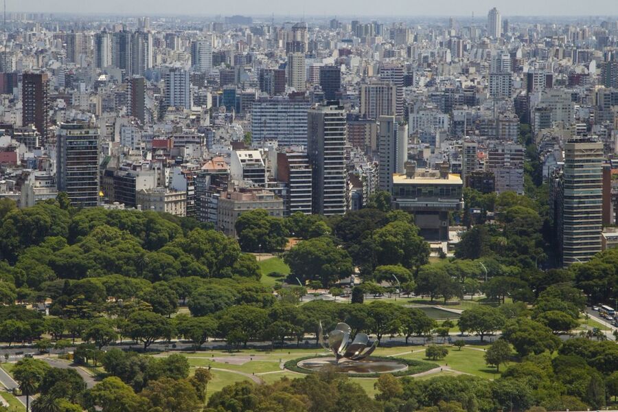 Aerial view of urban skyline and lush park in Buenos Aires.