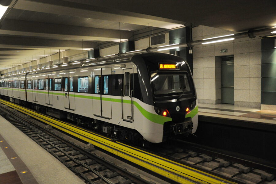 Modern subway train at a well-lit urban station, emphasizing sleek design and efficient public transportation.
