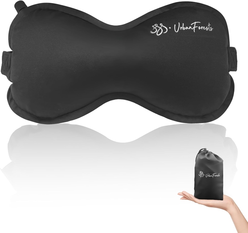 Self-inflating travel lumbar pillow by UrbanForests, displayed with its travel bag for easy portability.