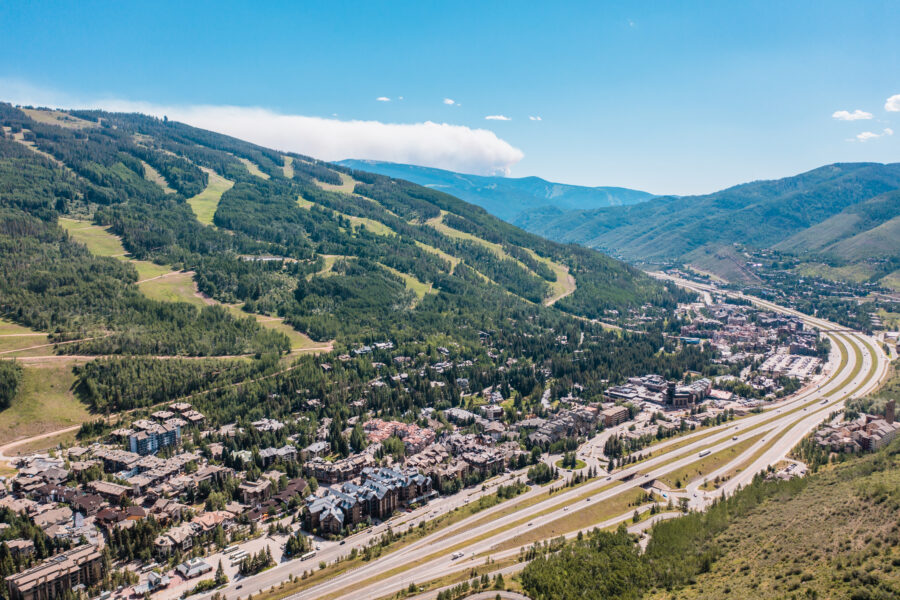 Scenic view of Vail, Colorado in summer, featuring the stunning Rocky Mountains and green valleys