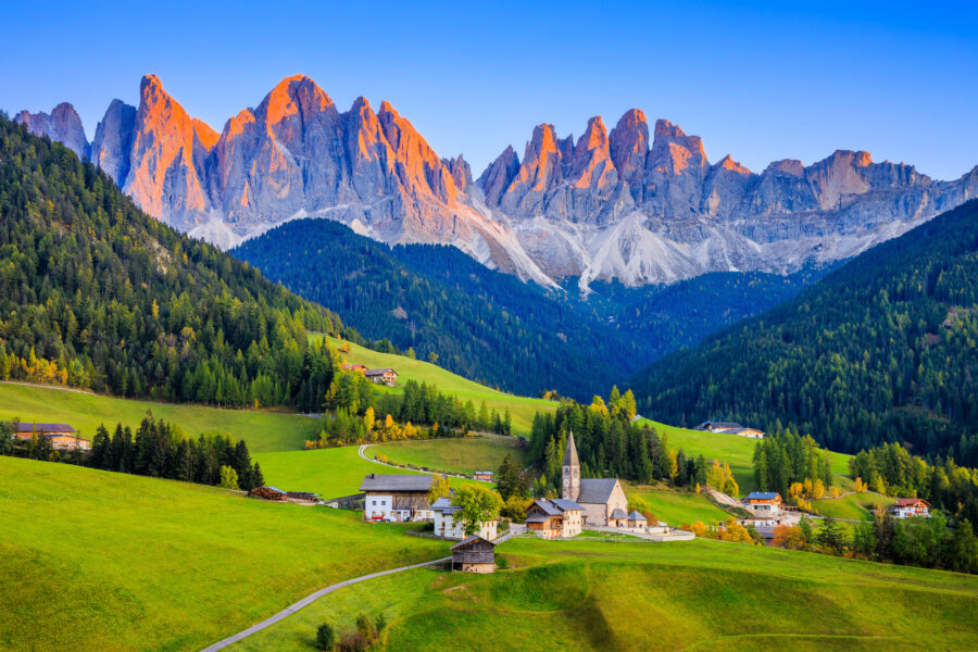 Sunset over Santa Maddalena village in Val di Funes, with the Odle mountain group in the background.