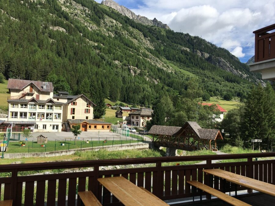 Vallorcine, Chamonix, France, surrounded by lush greenery and mountainous scenery.
