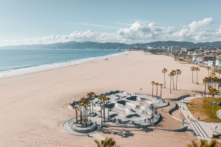 Aerial view of Venice Beach in Los Angeles, showcasing the vibrant coastline, sandy beach, and bustling boardwalk