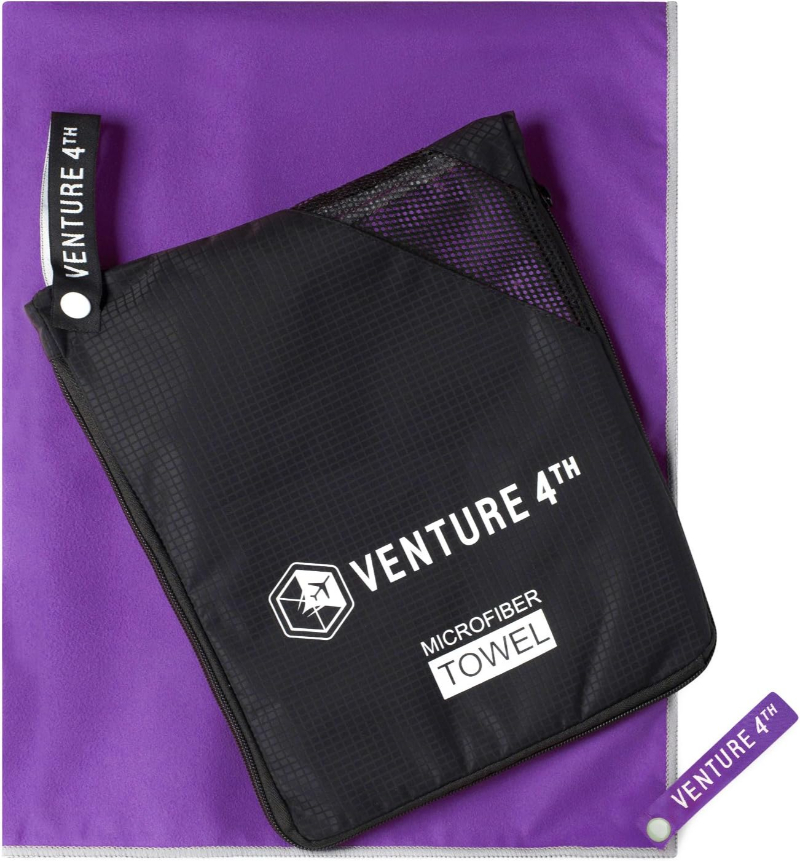Purple VENTURE 4TH Quick Dry Microfiber Camp Towel displayed on a white background, showcasing its compact design.
