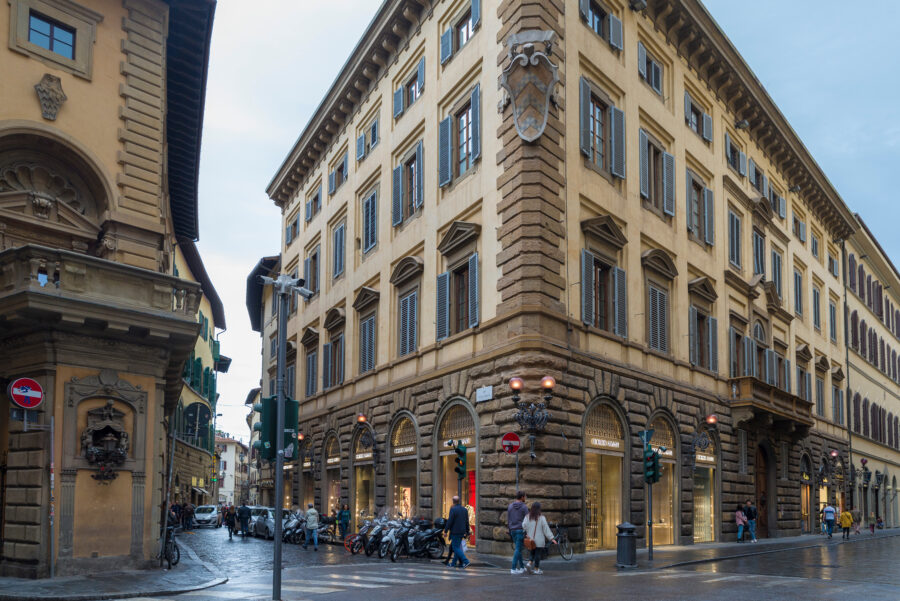 Luxury boutiques line the elegant Via de' Tornabuoni in Florence, showcasing high-end fashion and exquisite design