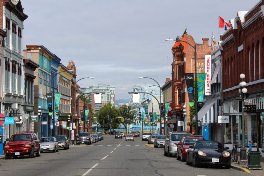 Scenic view of a row of buildings in Victoria, British Columbia, highlighting the city's unique architecture.