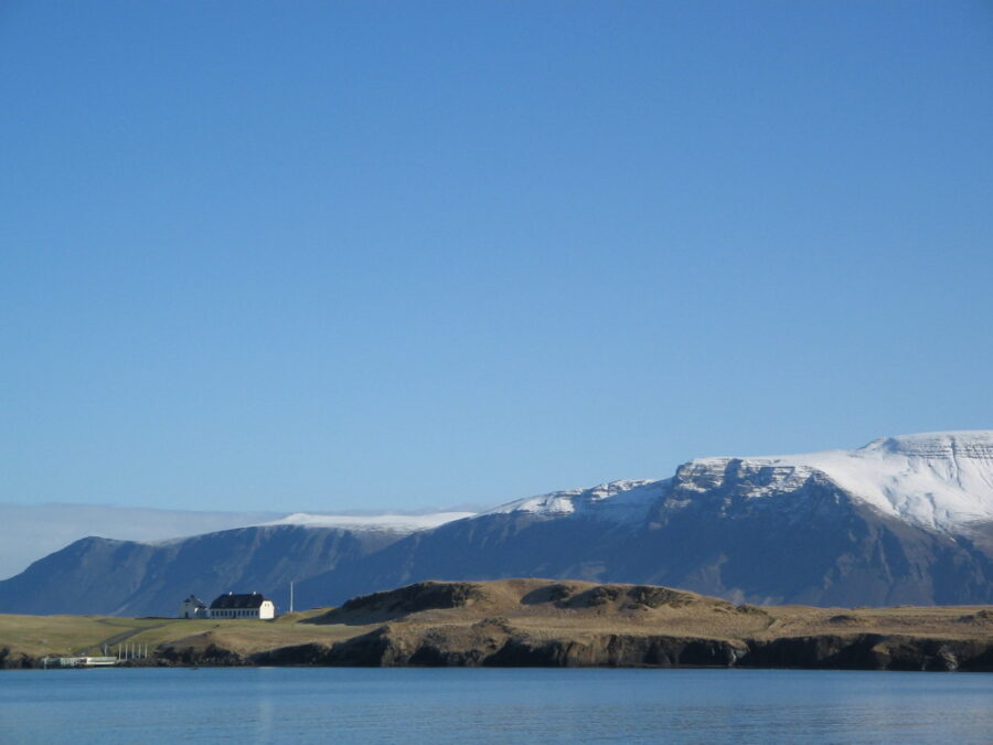 Calm waters encircling Viðey Island, Iceland, showcasing the natural beauty of the landscape.