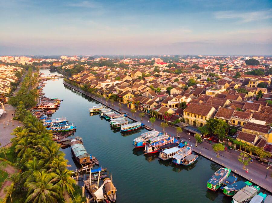 Aerial view of Hoi An ancient town in Vietnam, showcasing its historic architecture and winding river.