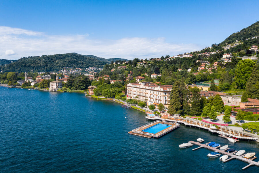 Elegant Villa d'Este hotel in Cernobbio, overlooking the serene Lake Como in Italy, surrounded by lush gardens