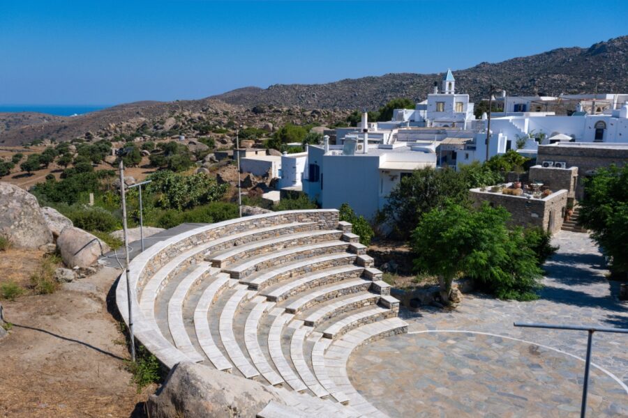 The stone-built amphitheater in Volax, Tinos, Greece, features classic architecture set against a picturesque landscape.
