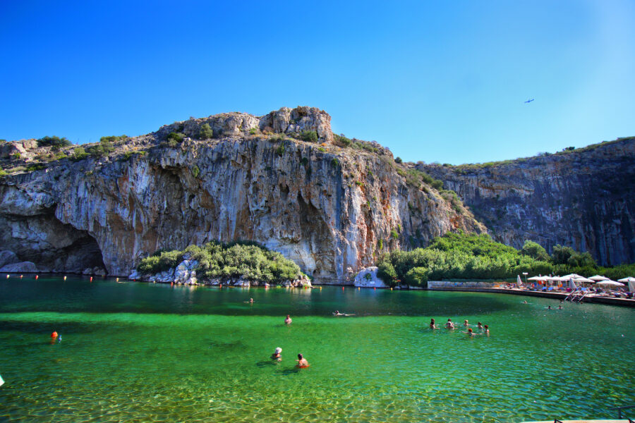 Beautiful Vouliagmenis Lake, a charming pond with clear waters near Athens, framed by vibrant landscapes