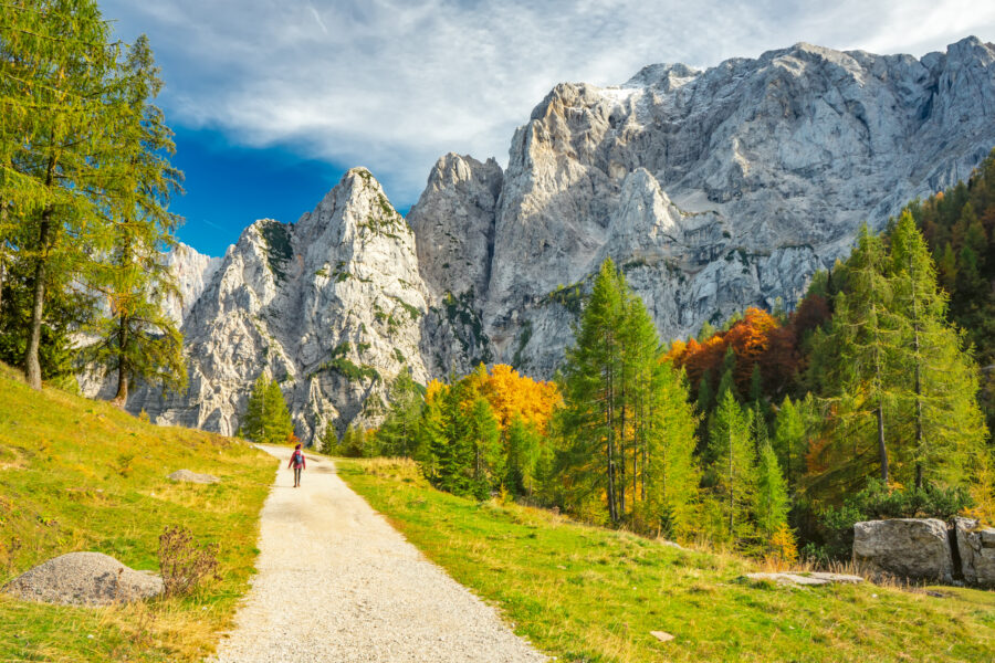 Panoramic landscape of Vršič Pass, Triglav National Park, featuring dramatic peaks and vibrant alpine scenery