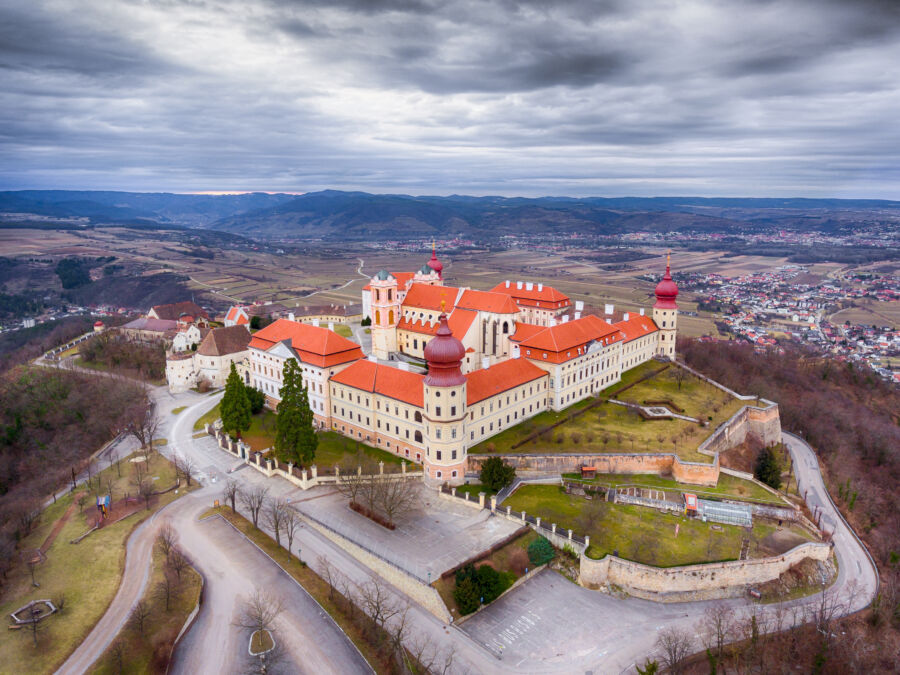 Aerial view of the Wachau Valley showcasing Göttweig Abbey surrounded by lush greenery and rolling hills in Austria