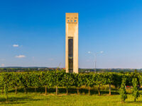 Scenic entrance to the Wagram wine region in Lower Austria, showcasing lush vineyards and rolling hills