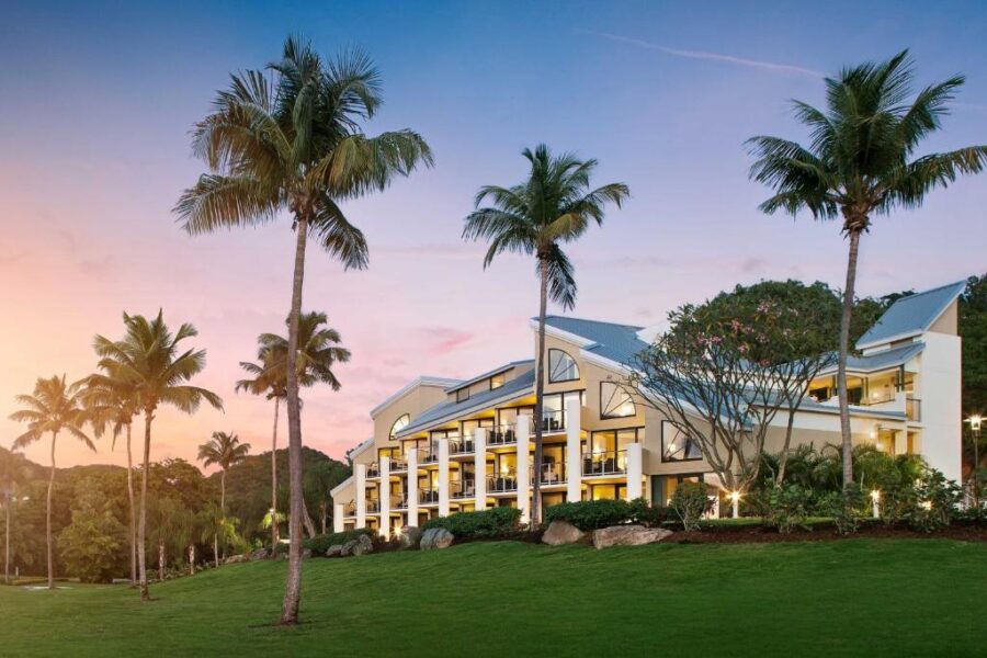 Sunset over the Westin St. John Resort Villas, casting vibrant colors across the sky and reflecting on the calm waters.