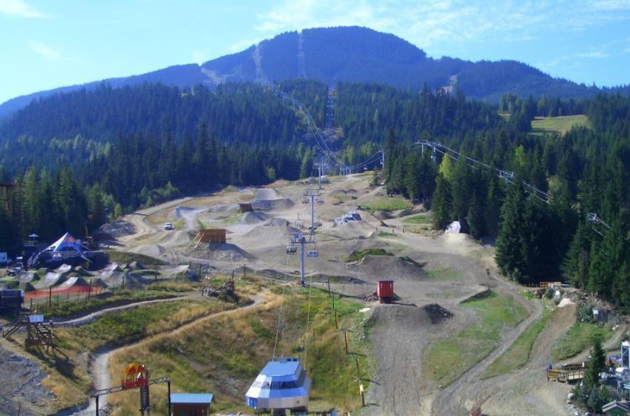Scenic mountain bike trail at Whistler Mountain Bike Park in British Columbia, showcasing a challenging bike course.