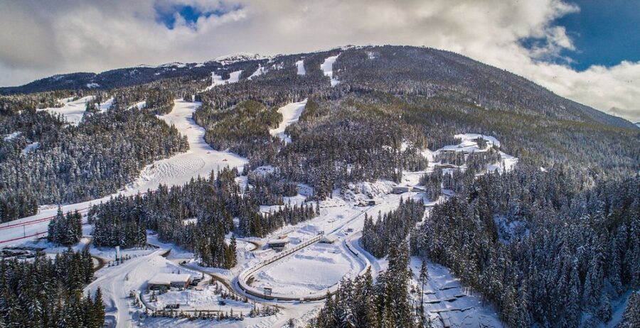 Panoramic view of a ski slope covered in snow at Whistler Sliding Centre, located in Whistler, British Columbia, Canada.