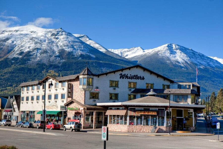 Panoramic view of Whistler's Inn in Jasper, Canada, showcasing its urban landscape and surrounding mountains.
