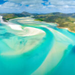 Scenic view of Hill Inlet at Whitehaven Beach, showcasing turquoise waters and white sands on Whitsunday Island, Queensland