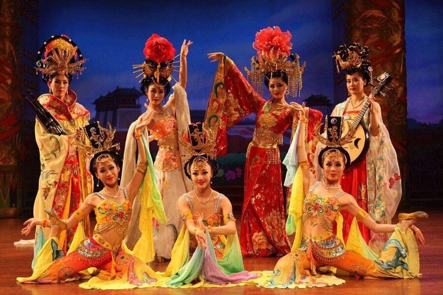 Women in colorful costumes perform a traditional Xian Tang Dynasty dance, showcasing cultural heritage and artistry.

