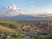 Aerial view of Yerevan, Armenia, showcasing the city's layout and surrounding landscape.