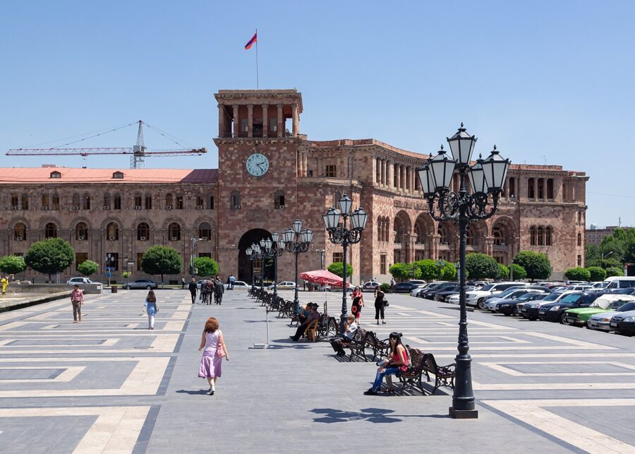 The Government House in Yerevan, Armenia, featuring a prominent clock tower on its large facade.