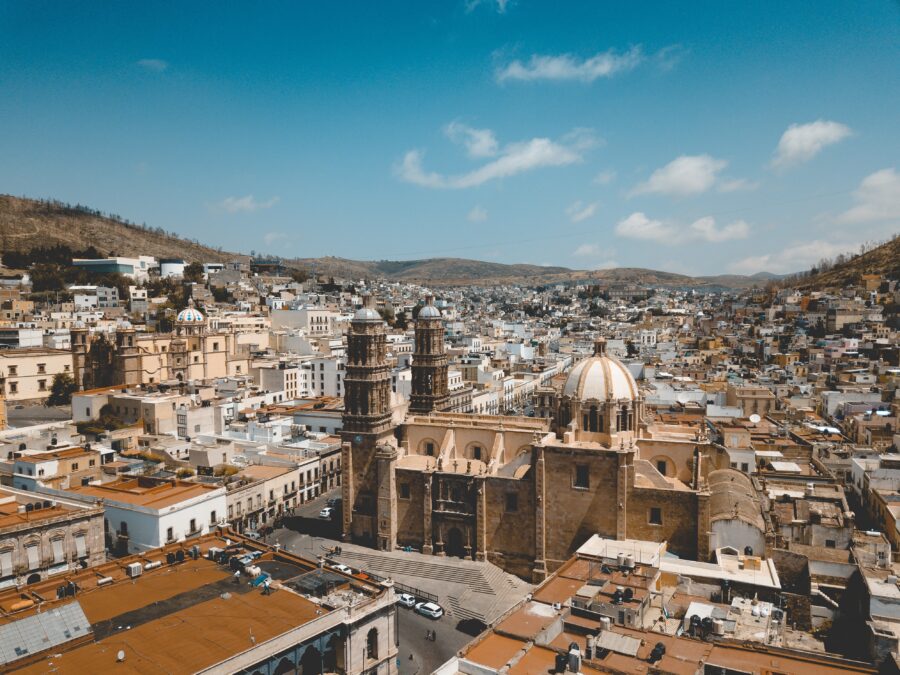 Aerial view of the Zacatecas Cathedral in Mexico, showcasing its architecture against a clear blue sky during the day