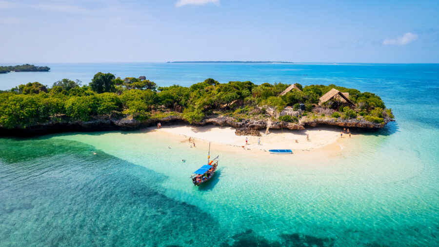 Stunning aerial shot of Zanzibar Island, featuring its beautiful coastline with white sandy beaches and sparkling turquoise sea 