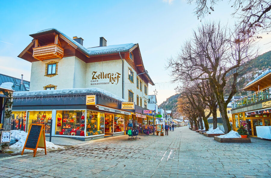 Street scene in Zell Am See's old town, featuring souvenir shops and restaurants serving local cuisine