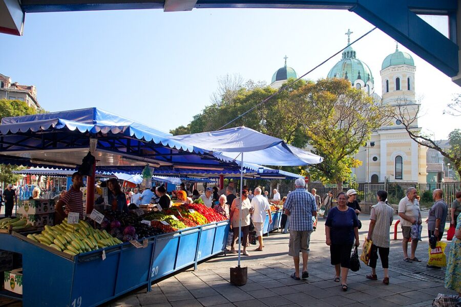 Vibrant Zhenski Pazar in Sofia, featuring lively vendors and a variety of fresh fruits, vegetables, and handmade products.