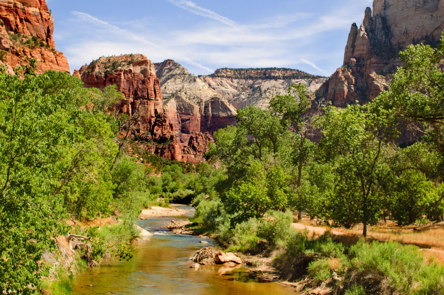Stunning mountain range under a clear blue sky in Zion National Park, Utah, showcasing nature's beauty on a sunny day