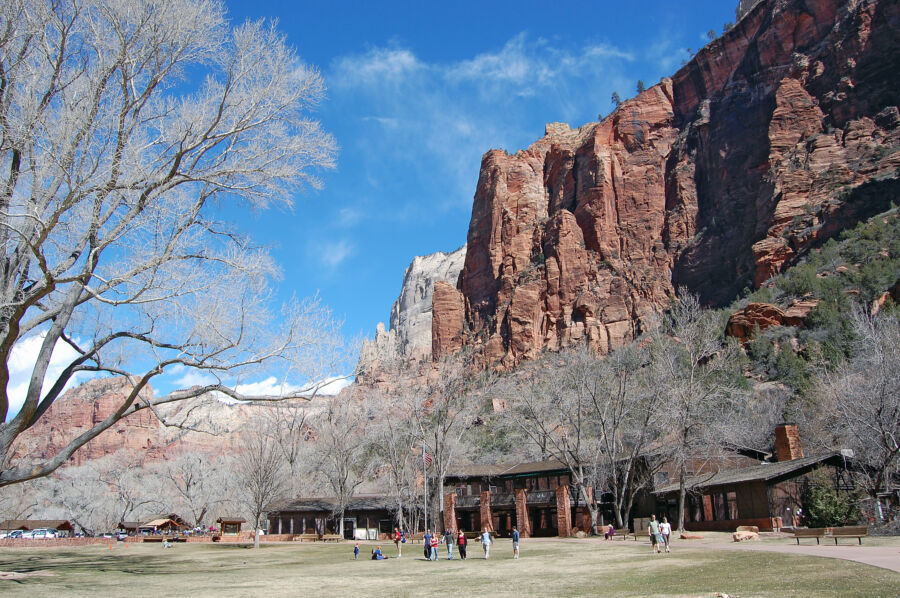 Zion National Park Lodge set against dramatic red rock scenery, offering a cozy retreat for nature lovers