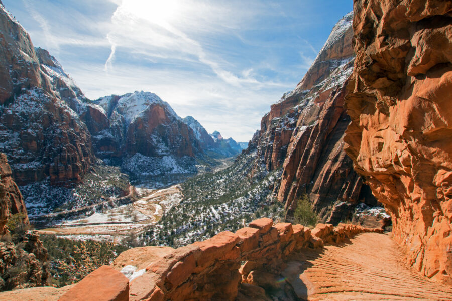 Winter view of Angels Landing Trail, high above the Virgin River in Zion National Park, showcasing snow-covered landscapes