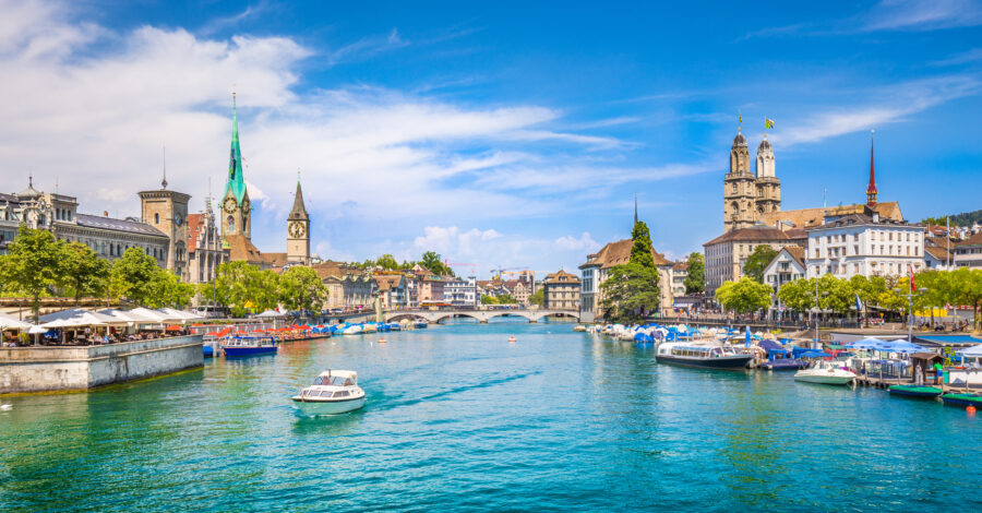 The vibrant city center of Zürich, Switzerland, with the serene river Limmat winding through its heart.
